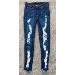 Fashion Nova dark wash distressed jeans with raw hem